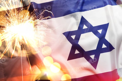 Preview: Flag of Israel, burning sparkler and bokeh lights, double exposure with sunset sky. National holiday