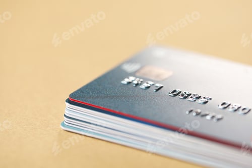 Preview: Stack of credit cards on table, closeup. Space for text