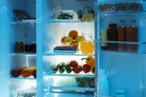 Preview: Modern refrigerator with different fresh food products in kitchen
