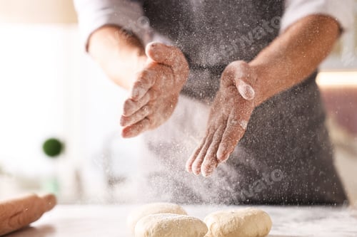 Preview: Man with dough at white table indoors, closeup