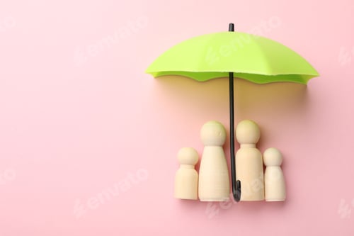 Preview: Small umbrella and family figures on pink background, flat lay. Space for text