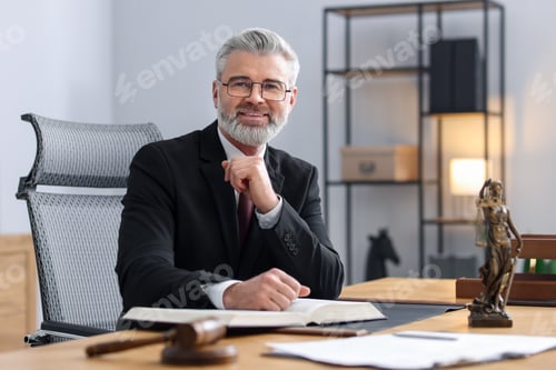 Preview: Portrait of smiling notary in glasses and suit with book at table in office