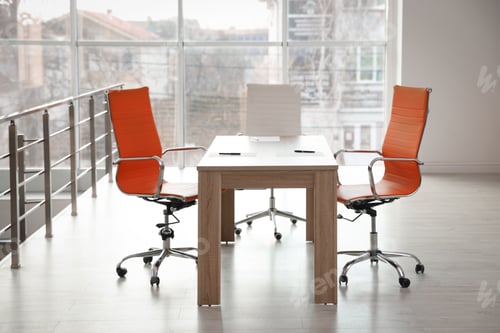 Preview: Stylish table and chairs in office. Interior design