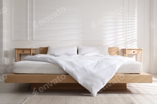 Preview: Orthopedic mattress, pillows and duvet on bed at home. Space for text