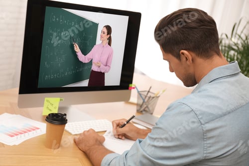 Preview: E-learning concept. Student having online video chat with teacher via computer at desk