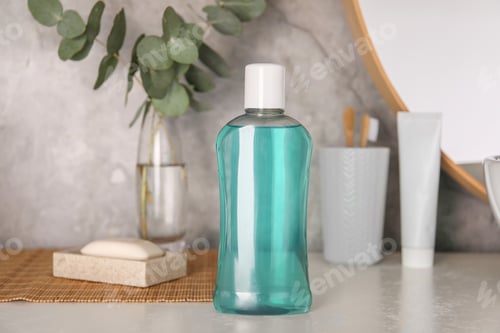 Preview: Bottle of mouthwash on light table in bathroom