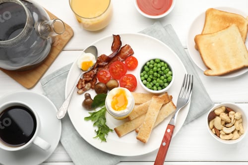 Preview: Tasty breakfast with soft boiled egg and bacon served on white wooden table, flat lay