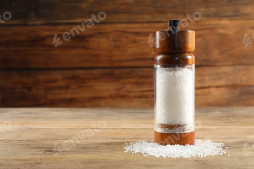 Preview: Salt shaker on wooden table, space for text