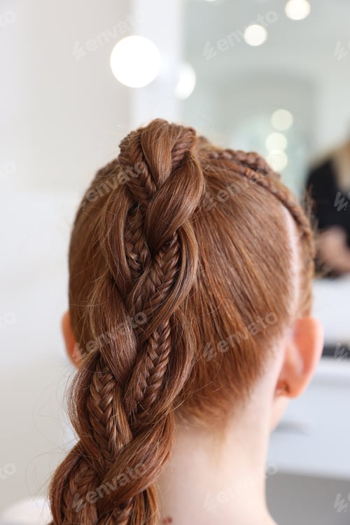 Preview: Teenage girl with beautiful braids in salon, back view