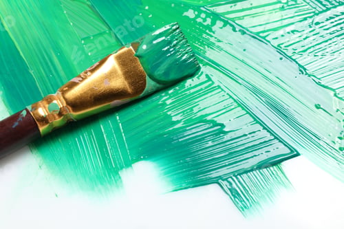 Preview: Strokes of green paint and brush on white background, closeup