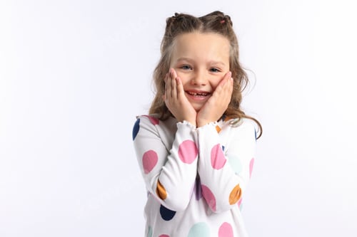 Preview: Cute little girl laughing at joke on white background