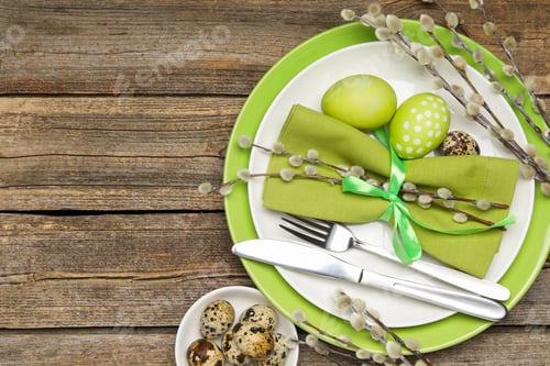 Preview: Festive table setting with Easter eggs and willow branches on wooden background, flat lay. Space for