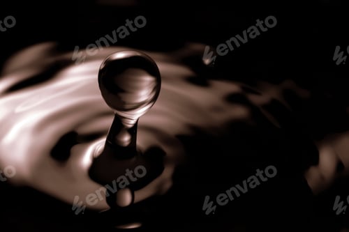 Preview: Soy sauce drop falling into liquid, closeup