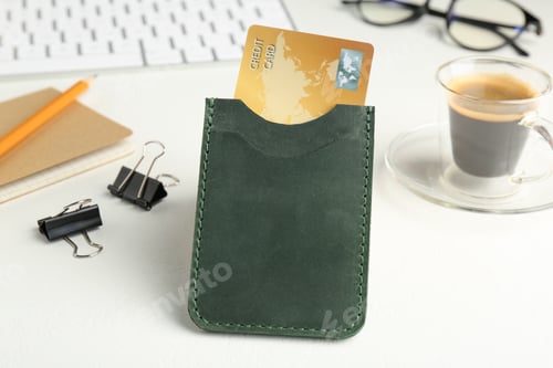 Preview: Leather card holder with credit card, stationery, coffee and keyboard on white table