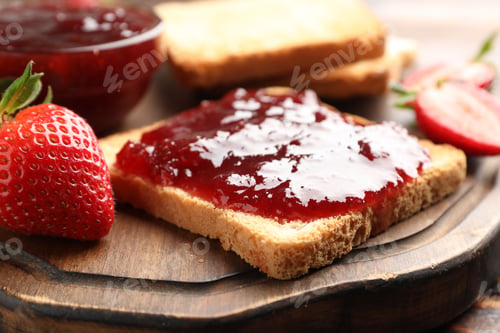 Preview: Toasted bread with strawberry jam and fresh berries on wooden table, closeup
