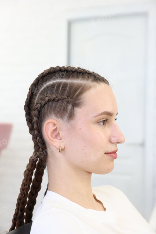 Preview: Teenage girl with beautiful braids in salon