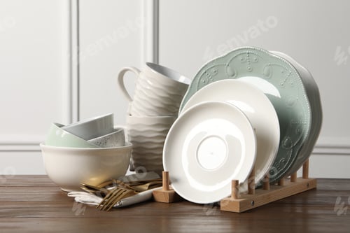 Preview: Beautiful ceramic dishware, cups and cutlery on wooden table