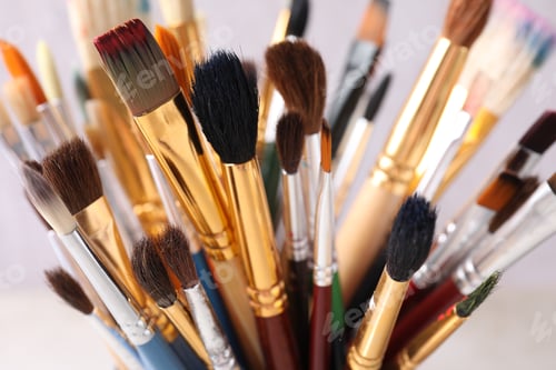 Preview: Different paint brushes on light background, closeup