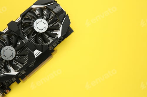 Preview: Computer graphics card on yellow background, top view. Space for text