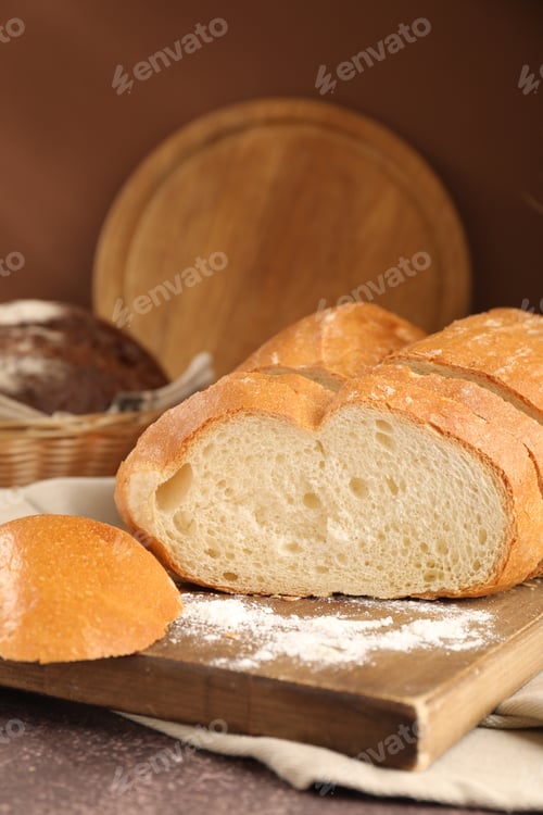 Preview: Different types of bread on grey table, closeup