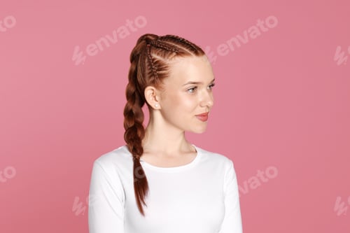 Preview: Teenage girl with beautiful braids on pink background
