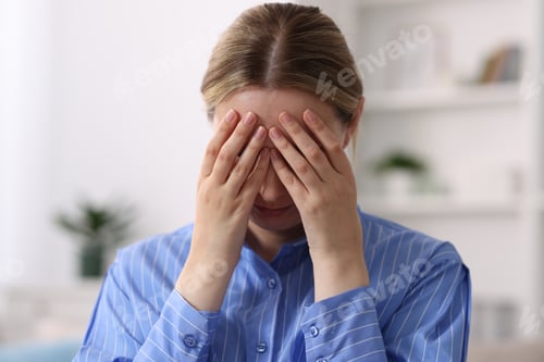Preview: Menopause. Woman suffering from headache at home