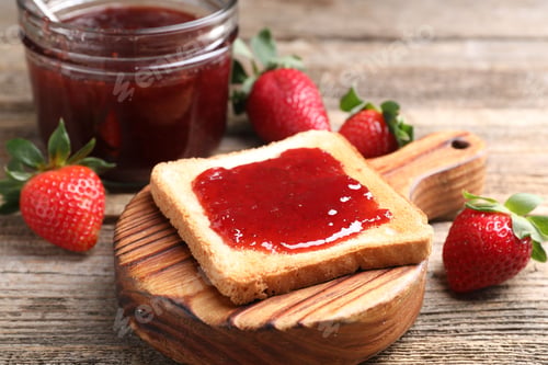 Preview: Toasted bread with strawberry jam and fresh berries on wooden table, closeup