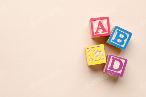 Preview: Wooden cubes with letters on beige background, flat lay. Space for text