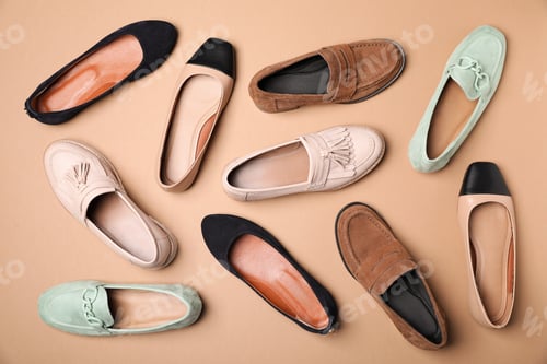 Preview: Different beautiful shoes on beige background, flat lay