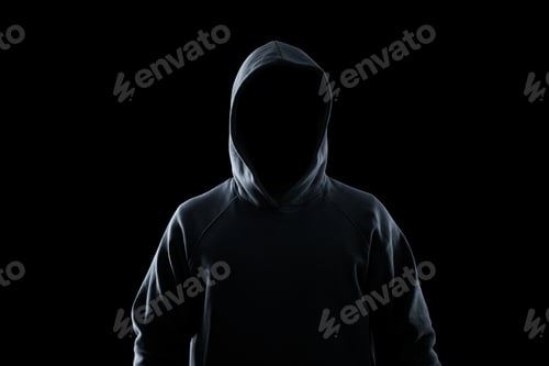 Preview: Anonymous man in hood on black background. Criminal concept