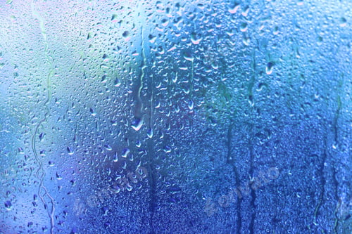 Preview: Window glass with rain drops and drips, closeup