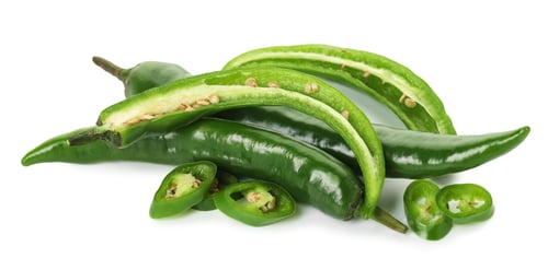Preview: Whole and cut green chili peppers isolated on white
