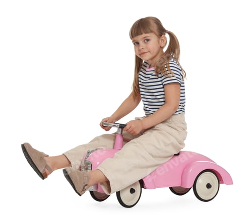 Preview: Little child driving toy car on white background