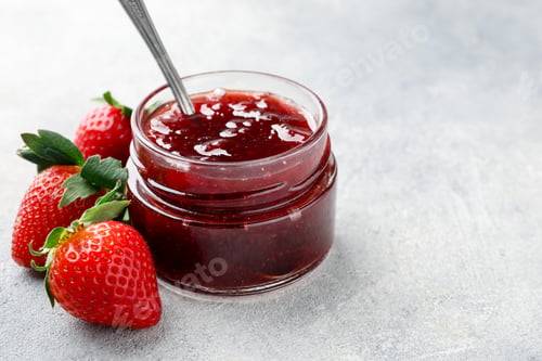 Preview: Tasty strawberry jam in jar and fresh berries on light grey table, closeup. Space for text