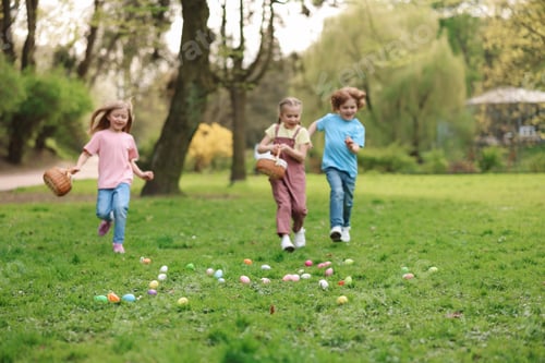 Preview: Easter celebration. Little children hunting eggs outdoors, selective focus