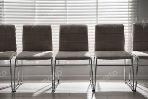 Preview: Many stylish chairs near window in office