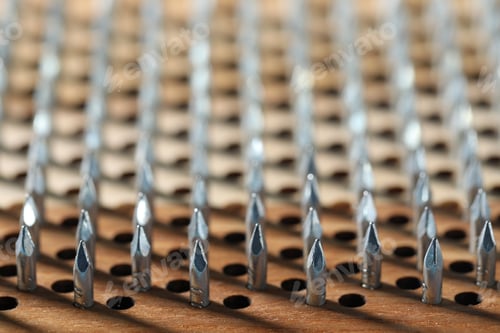 Preview: Nail standing practice. Sadhu board as background, closeup
