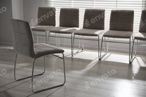 Preview: One chair in front of other seats in office