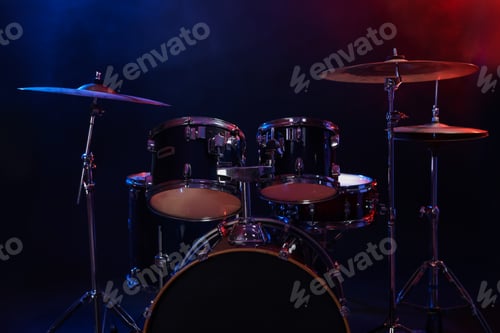 Preview: Drum kit in color lights against dark background