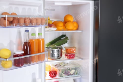 Preview: Modern refrigerator with different fresh food products, closeup
