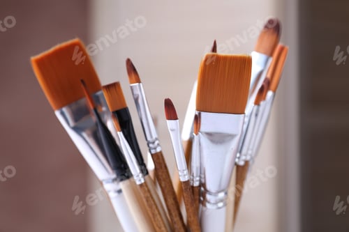 Preview: Different paint brushes on blurred background, closeup