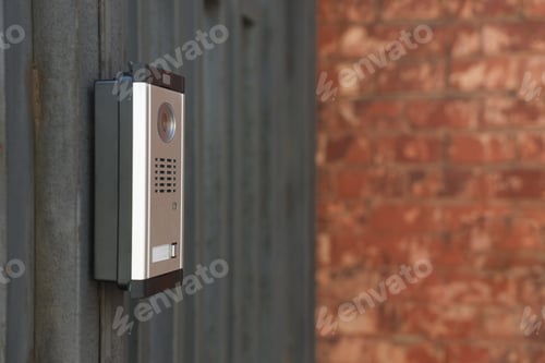 Preview: Modern intercom system on gate outdoors, closeup. Space for text