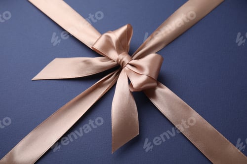Preview: Beige satin ribbon with bow on blue background