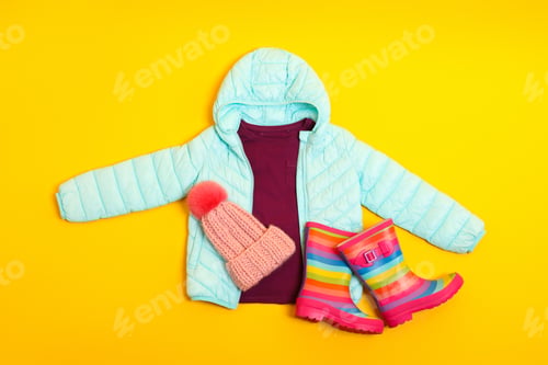 Preview: Flat lay composition with stylish child clothes and shoes on yellow background