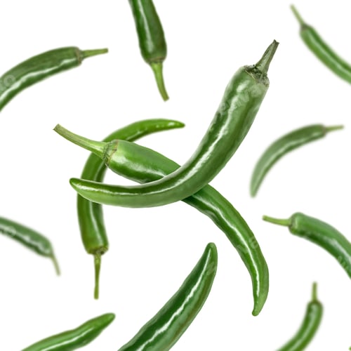 Preview: Green chili peppers flying in air on white background