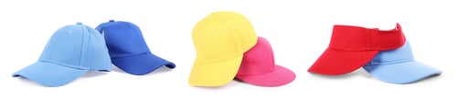 Preview: Baseball and visor caps in different colors isolated on white, set