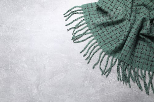 Preview: Soft green scarf on light grey background, top view. Space for text