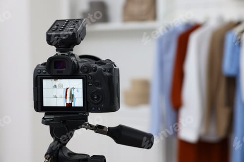 Preview: Fashion blogger's workplace. Stylish clothes indoors, focus on camera