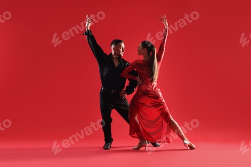 Preview: Couple of professional dancers on red background