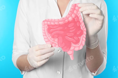 Preview: Doctor with paper intestine cutout on light blue background, closeup